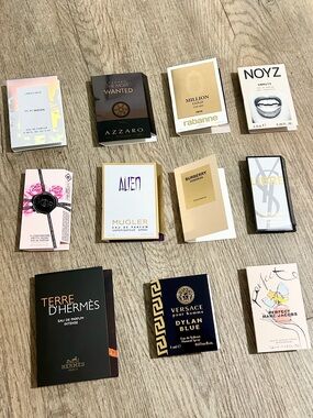 Bundles of 11 assorted brand name perfume samples.